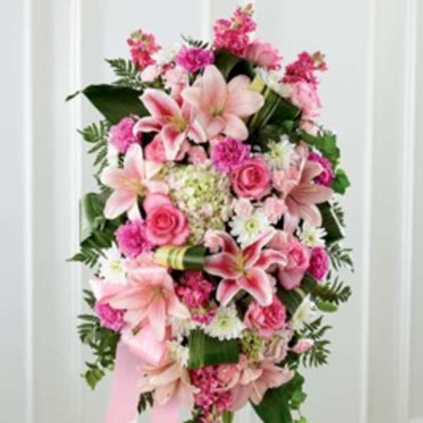 Pink and white floral standing spray with lilies and roses