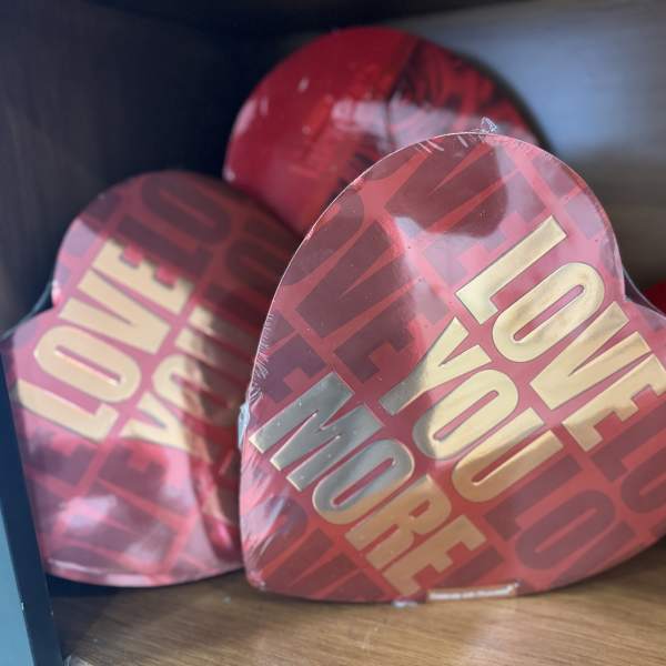 Heart-shaped boxes with "LOVE YOU MORE" text