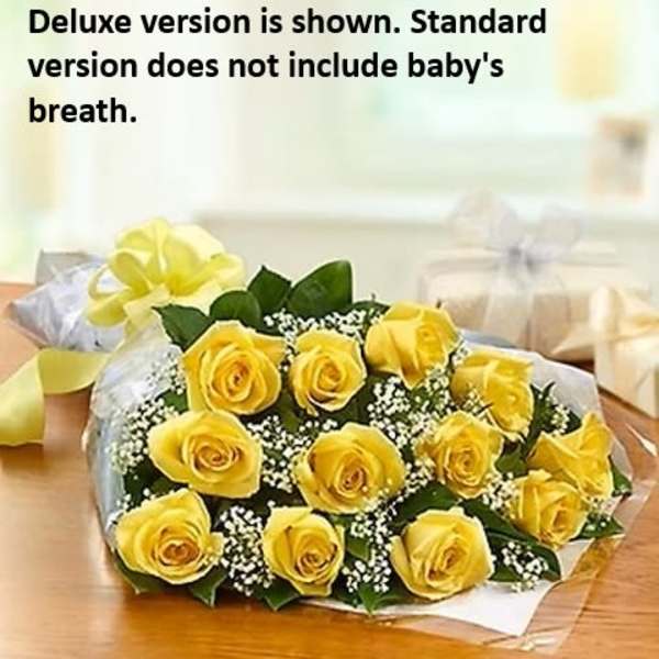 Bouquet of yellow roses with baby's breath on a table