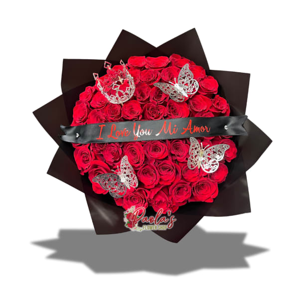 Heart-shaped bouquet of red roses with butterfly decorations and a ribbon