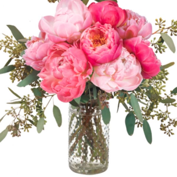 Pink peony bouquet in a clear glass vase
