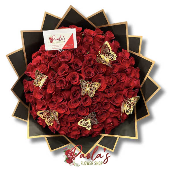 Large bouquet of red roses with gold butterfly decorations