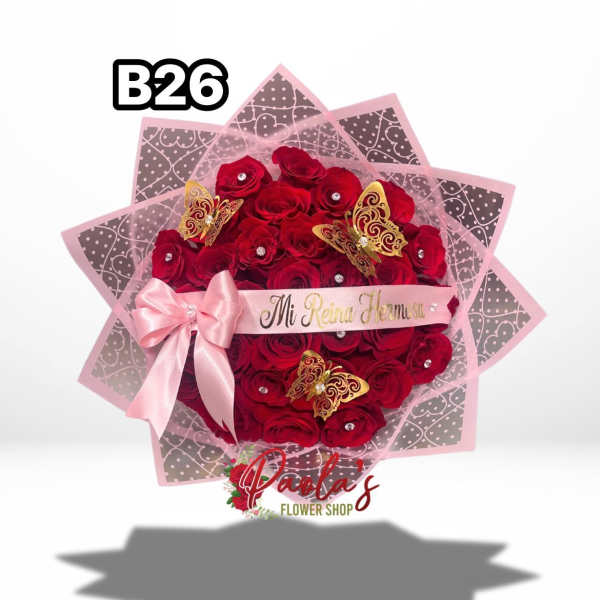 Red rose bouquet with pink wrapping, ribbon, and butterfly accents