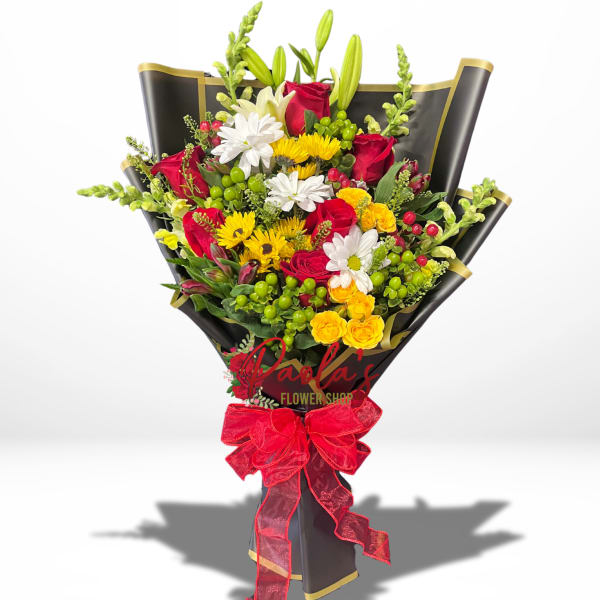 Bouquet of red roses, white daisies, and yellow flowers wrapped in black paper