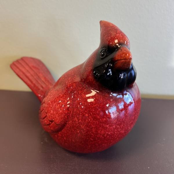 Red decorative bird figurine with a glossy finish