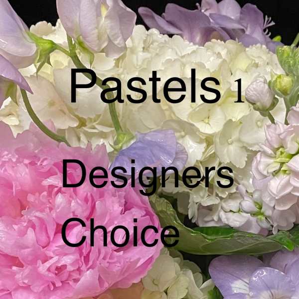 Pastel arrangement of pink peony, blush rose, white hydrangea and greenery in a white vase