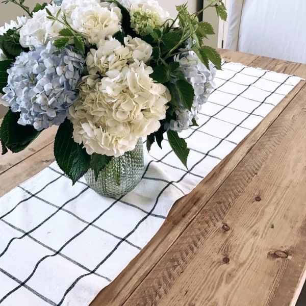Hydrangea bouquet in a glass vase on a dining table