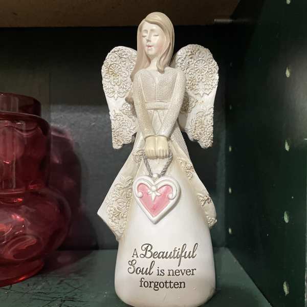 Decorative angel figurine with a pink heart and memorial text