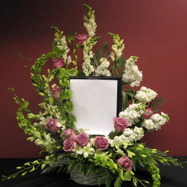 Floral wreath around a framed blank center with pink roses and white blooms