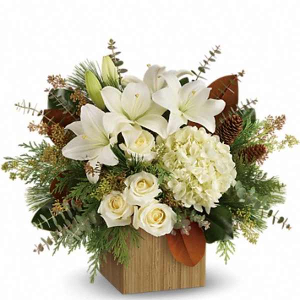 White lilies and roses in a wooden box arrangement
