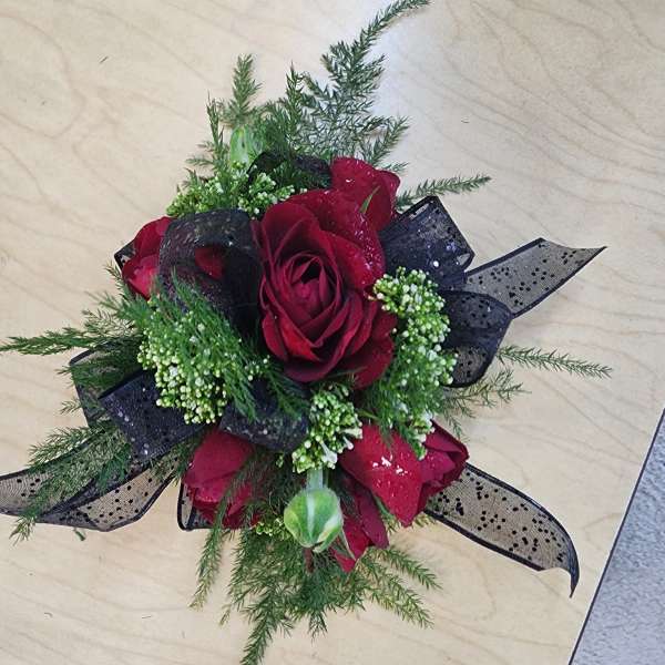 Red rose bouquet with black ribbon and greenery