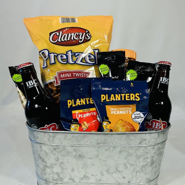 Gift basket with pretzels, peanuts, and bottled drinks in a metal tub