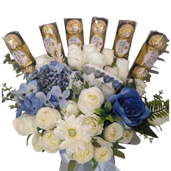 Bouquet of white and blue flowers with Ferrero Rocher chocolates