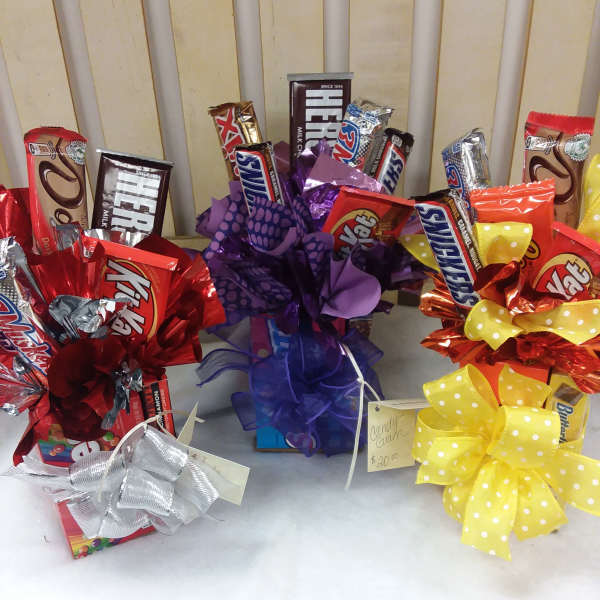 Candy gift bouquets with chocolate bars and large ribbon bows