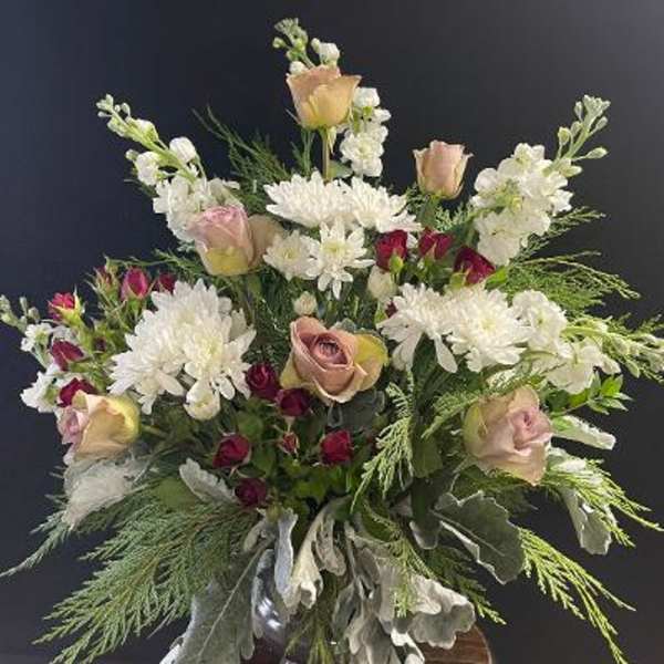 Bouquet of white chrysanthemums and blush roses with greenery