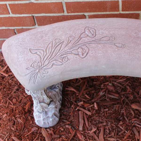 Decorative stone bench with a floral relief pattern