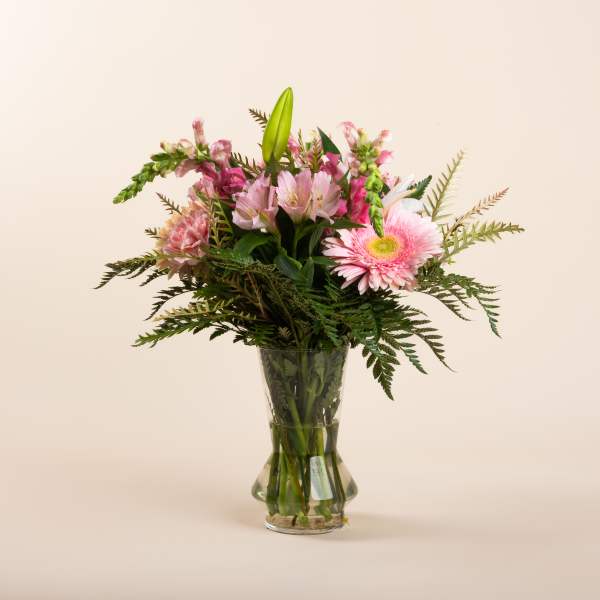 Pink mixed bouquet in a clear glass vase