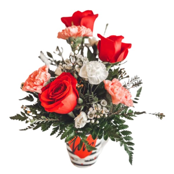 Red roses and carnations in a patterned vase