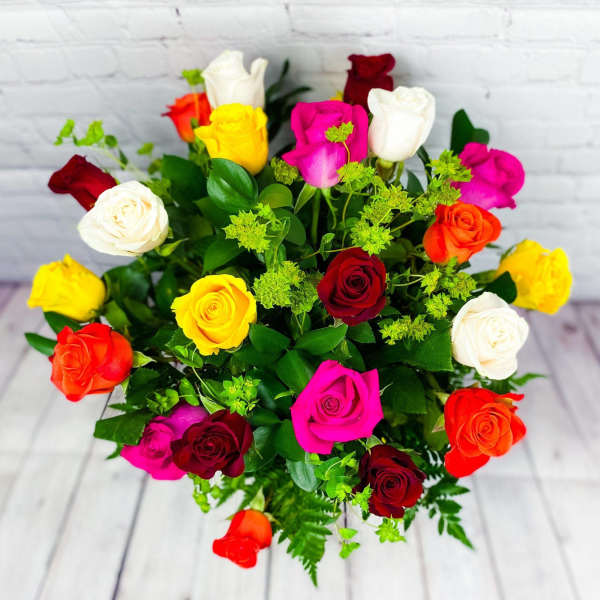 Bouquet of multicolored roses with green filler