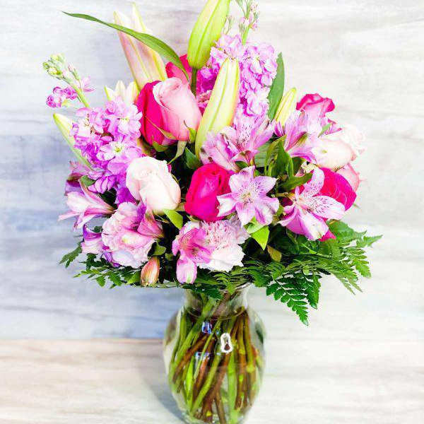 Pink and white mixed bouquet in a glass vase