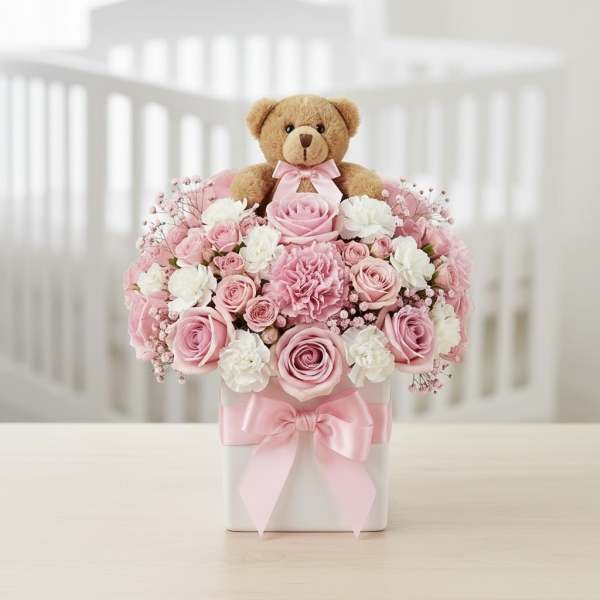 Pink rose arrangement with a teddy bear in a white box
