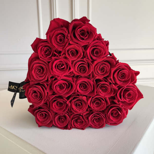 Bouquet of red roses wrapped in black ribbon