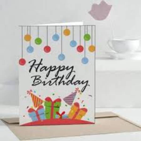 Birthday greeting card with colorful hanging ornaments and gift boxes