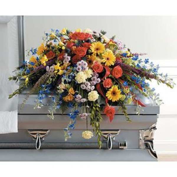 Colorful floral casket spray with roses and daisies