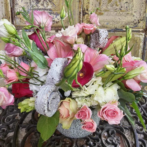 Pink and white mixed bouquet with roses, lilies, and calla lilies