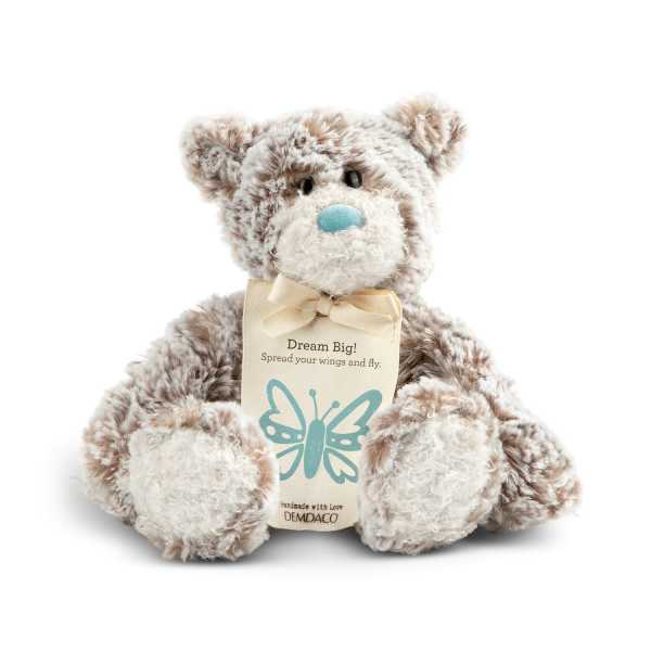 Plush teddy bear with a tag and bow