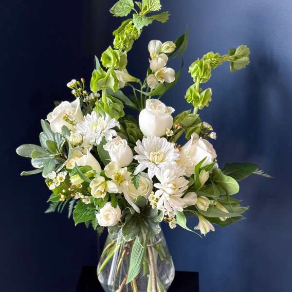 White floral arrangement in a clear glass vase