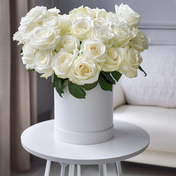 White rose bouquet in a white cylindrical box