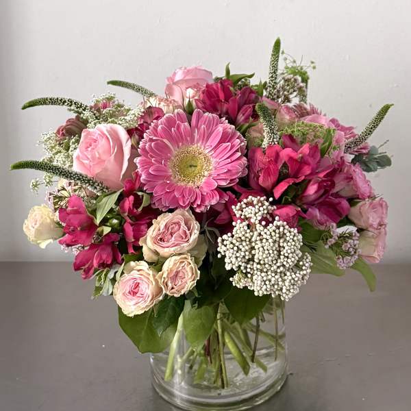 Pink mixed bouquet in a clear glass vase