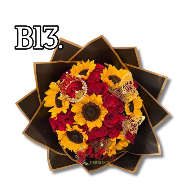 Bouquet of red roses and yellow sunflowers in dark wrapping with butterfly accents