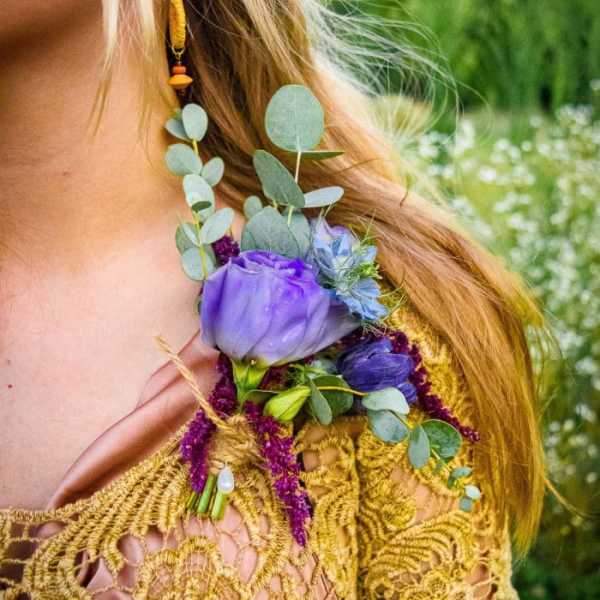 Purple floral shoulder corsage with eucalyptus and blue accents