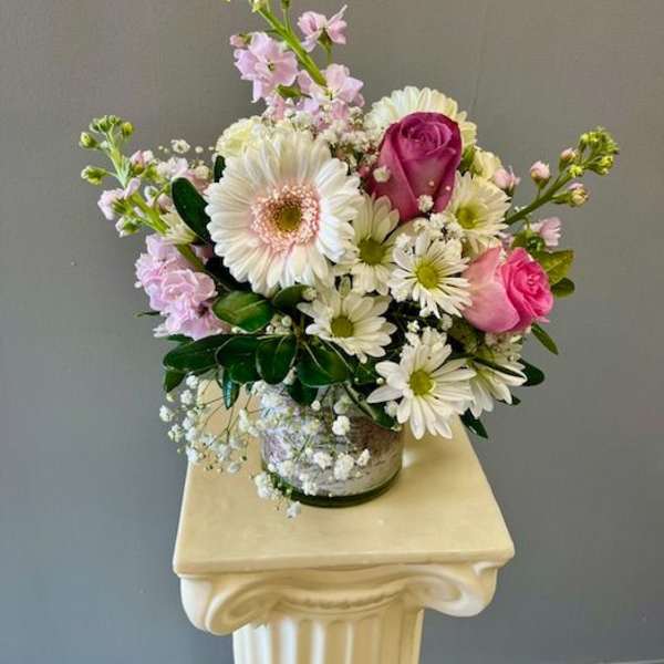 Pink and white mixed bouquet in a glass vase