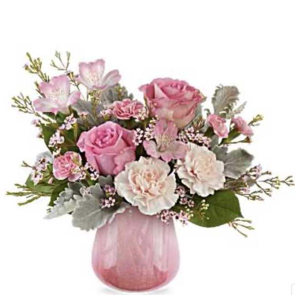 Pink and white flower arrangement in a pink glass vase