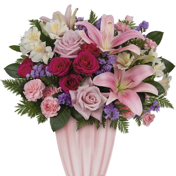 Pink and white mixed bouquet in a pink glass vase