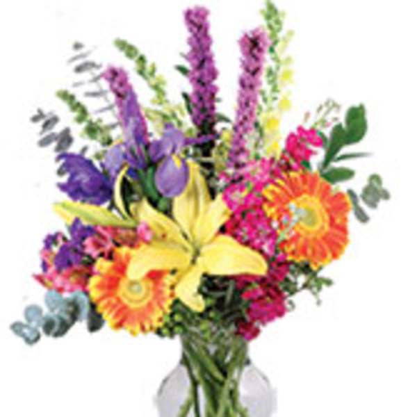 Colorful mixed bouquet in a clear glass vase