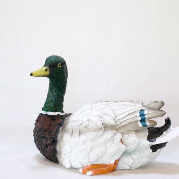 Decorative duck figurine with a green head and white body