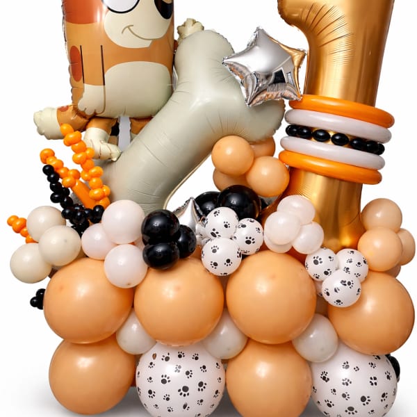 Dog-themed balloon arrangement with a large gold number 1