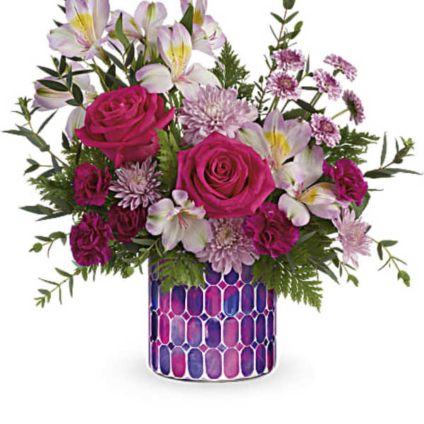 Pink roses and white lilies in a patterned vase