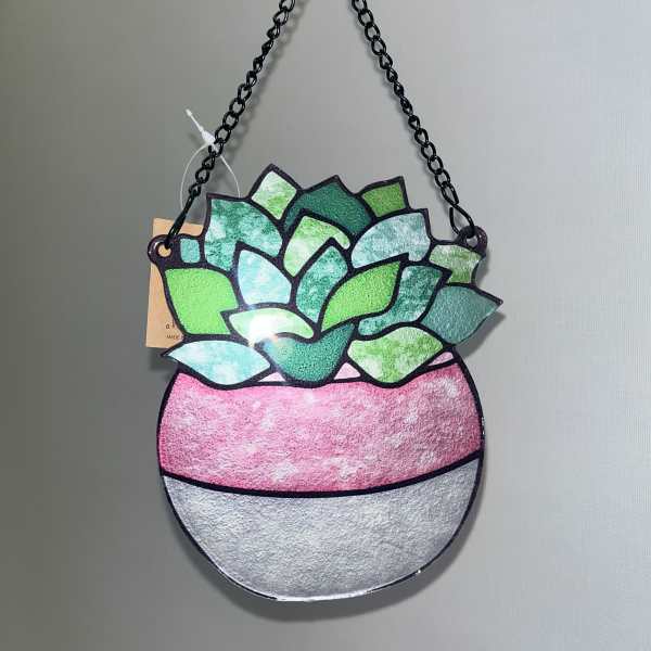 Hanging succulent-shaped wall decor with a black chain