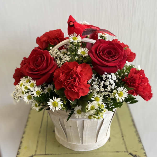 Basket of red roses and carnations with white daisy flowers