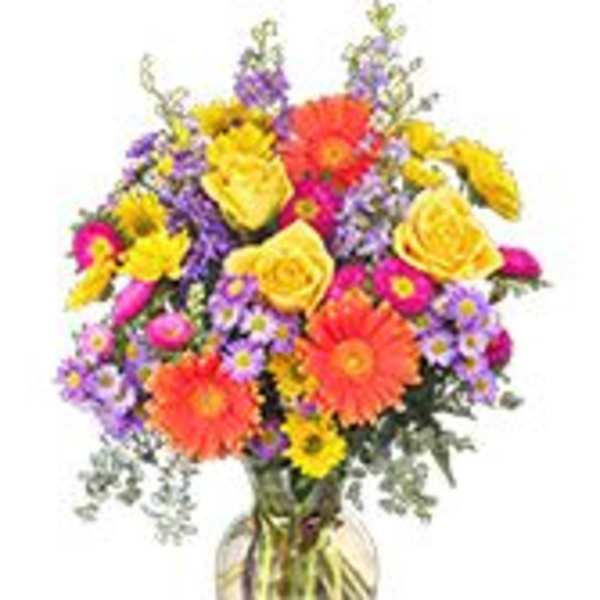 Colorful mixed bouquet in a clear glass vase