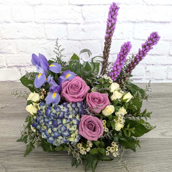 Bouquet with purple roses, blue hydrangea, and lavender iris