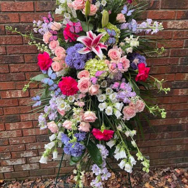 Large standing floral spray with pink roses and lilies