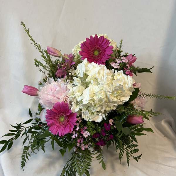 Pink gerberas and white hydrangeas in a mixed bouquet