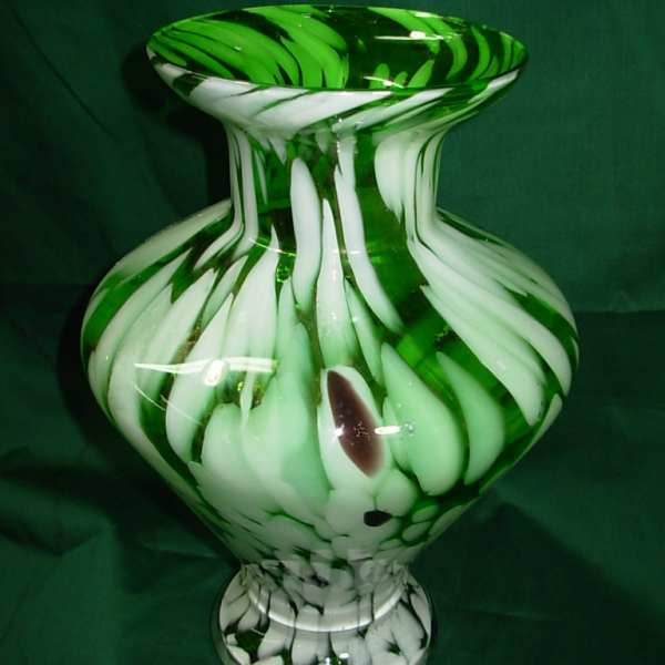 Green and white glass vase with swirled pattern