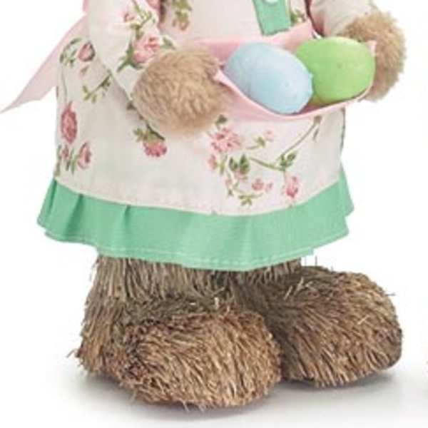 Bunny figurine holding pastel Easter eggs